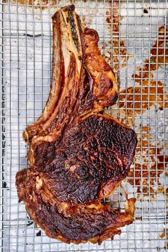 a piece of meat sitting on a wire rack at Dawn Ranch in Guerneville