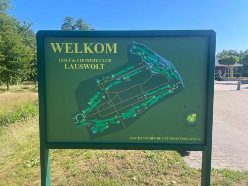 a sign for a golf course country club landmark at Huis aan de Haven in Lemmer