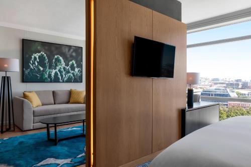 a hotel room with a bed and a couch at The Westin Cape Town in Cape Town