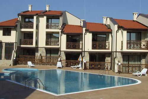 a large swimming pool in front of a building at Dream Villa in Imperial Heights Villas in Sunny Beach