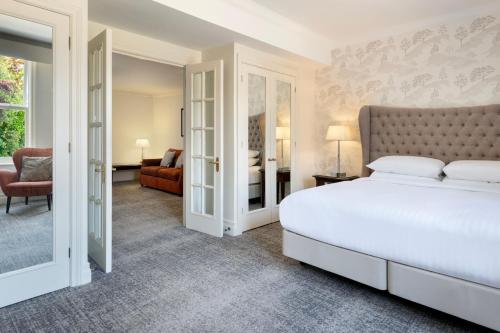 a bedroom with a bed and a living room at Delta Hotels by Marriott Preston in Preston