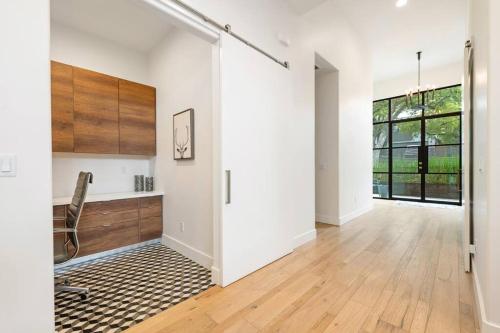 an empty room with a chair and a desk at central contemporary w/ POOL and SPA in Austin