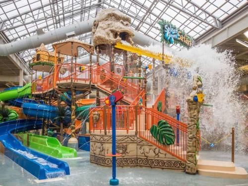 a large water park with a water slide at Ambiance - KING BED Cabin Loft & Fireplace in Tobyhanna