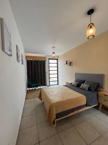 a bedroom with a large bed in a room at Casa Baltazar in Santa María Tonantzintla