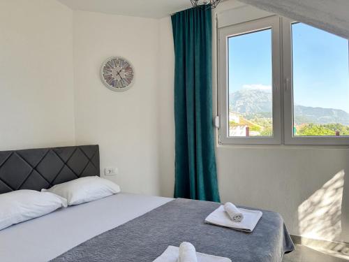 Una cama o camas en una habitación de Jasmin apartmani