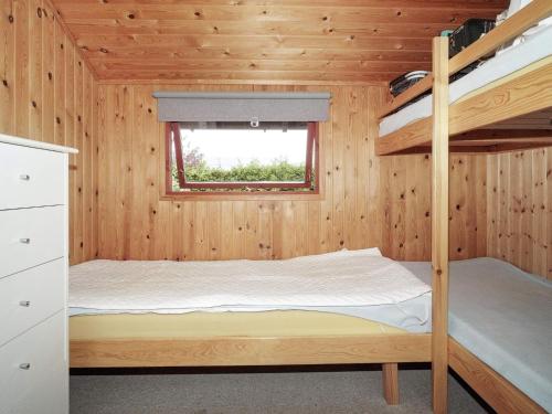 a bedroom with a bunk bed in a cabin at Holiday home Jægerspris XIX in Jægerspris