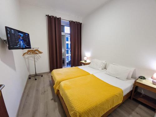 Postel nebo postele na pokoji v ubytování Casa da Ribeira