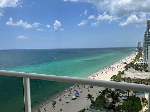 a view of the beach from the balcony of a resort at Penthouse Beach Front 1st line, 2 BR, 2 BA, New Decoration & Furnitures, unobstructed view of the beautiful Atlantic, free parking in Hollywood