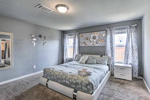 a bedroom with a large bed and a window at Modern Home near Downtown Dallas in Lancaster