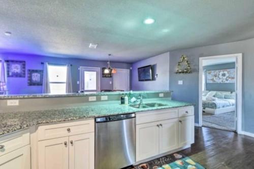 a kitchen with purple walls and a counter top at Modern Home near Downtown Dallas in Lancaster