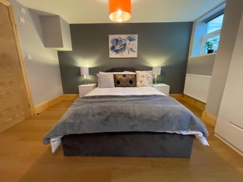 a bedroom with a large bed and a window at West Midlands-2 Double Bed Room Apartment in Dudley
