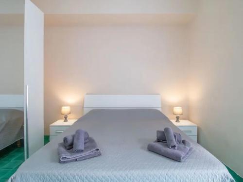 Voodi või voodid majutusasutuse Lucia House mare Nettuno toas