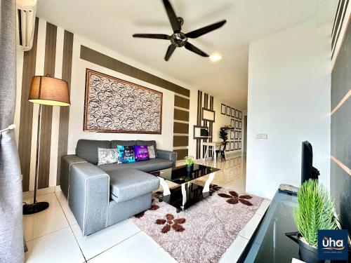 a living room with a couch and a ceiling fan at 1 Tebrau Residences By RR JBcity in Johor Bahru