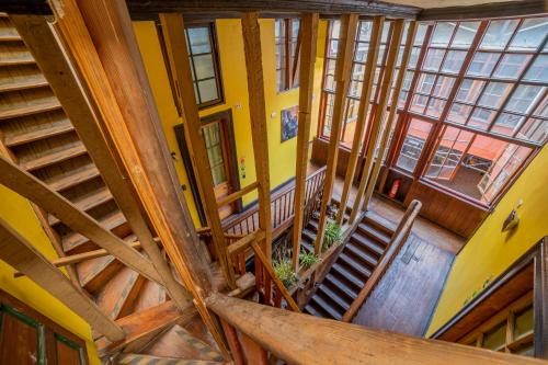 an overhead view of a building with wooden ceilings andwindows at La Casa Del Puerto, Hostal cultural, Cerro Alegre in Valparaíso