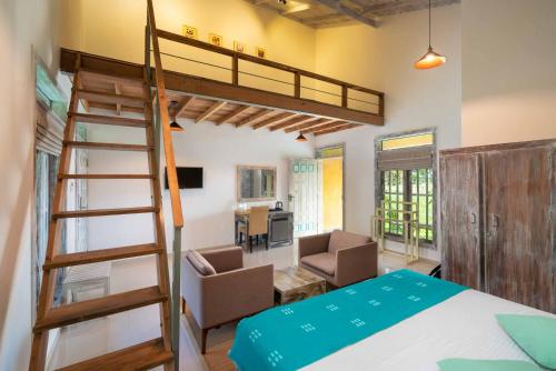 a bedroom with a bunk bed and a ladder at Palmera Eco Resorts Nilaveli in Trincomalee