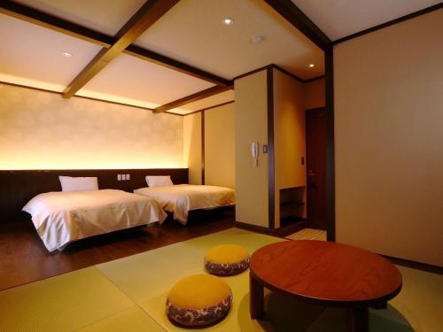 Giường trong phòng chung tại Kii no Matsushima