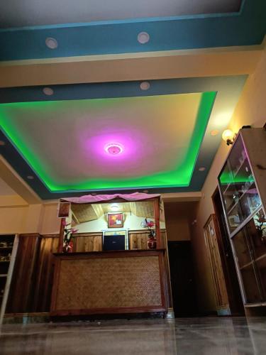 a room with a large screen on the ceiling at Hotel Om Residency in Darjeeling