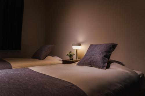 Cama o camas de una habitación en YOICHI inn HAKONE