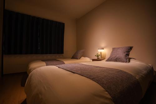 Cama o camas de una habitación en YOICHI inn HAKONE