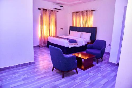 Postel nebo postele na pokoji v ubytování Credence Resorts Aco