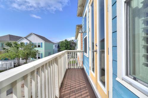 a balcony of a house with a window at Casa de Flip Flops in Rockport
