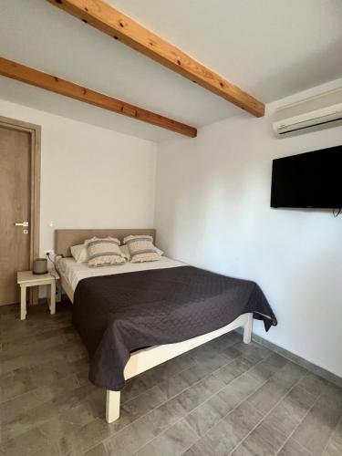 Postel nebo postele na pokoji v ubytování Akti Kastraki Beach