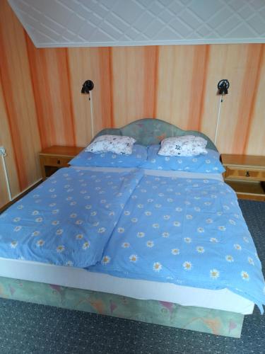 Postel nebo postele na pokoji v ubytování Ibolya Apartman