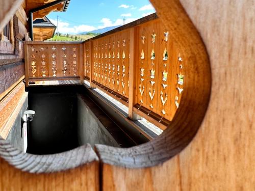 a view of a swimming pool from a wooden balcony at Chaty Misiagi in Poronin