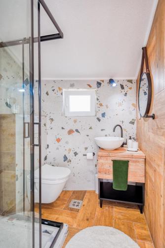 a bathroom with a tub and a sink and a shower at Miro guesthouse in Tivat