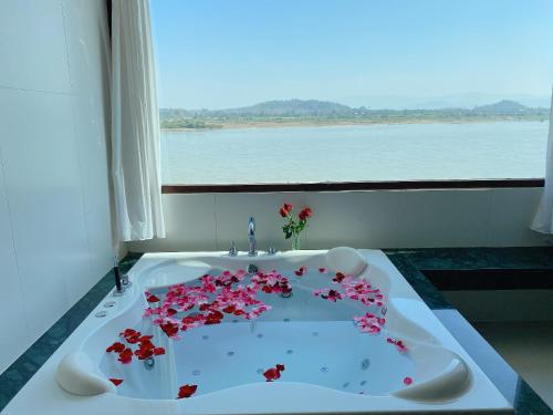 a bathroom with a sink with flowers on it at Siam Triangle Hotel Chiang Sean in Chiang Saen