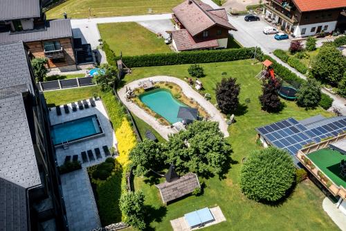 an aerial view of a house with a swimming pool at THE MATTHEW - Copper Lodge in Wagrain