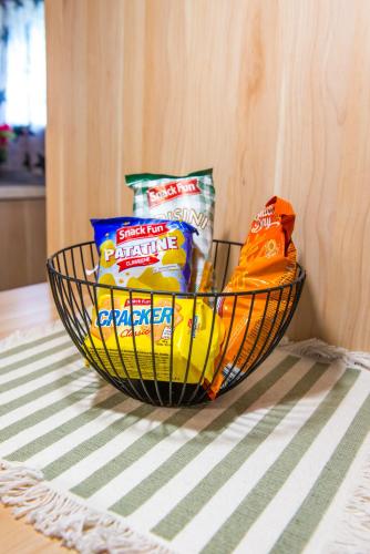 a basket of chips and other snacks on a table at Boho House 3 camp Terme Catez with promotional tickets prices in Čatež ob Savi