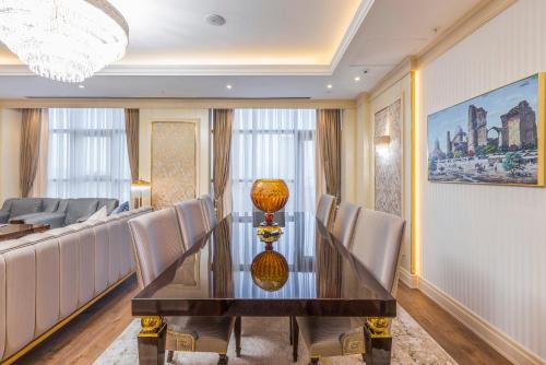 a dining room with a table and chairs at Hilton Garden Inn Samarkand Sogd in Samarkand