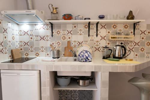 a kitchen with a sink and a counter top at Nomad Sud Studios in Town Center in Cahul