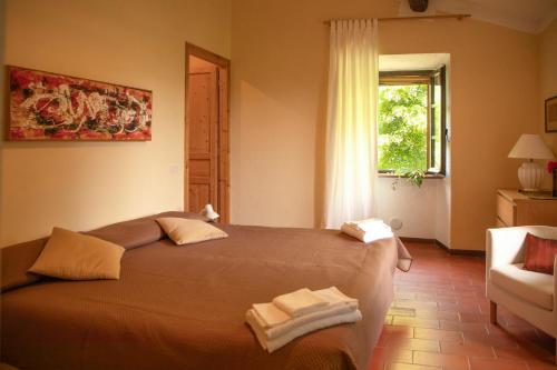Ένα ή περισσότερα κρεβάτια σε δωμάτιο στο Agriturismo KeBio I Tenuta di Fassia