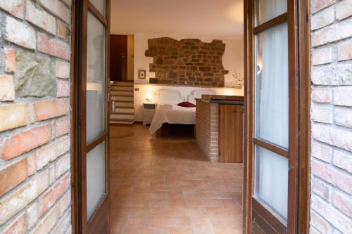 Ένα ή περισσότερα κρεβάτια σε δωμάτιο στο Agriturismo KeBio I Tenuta di Fassia