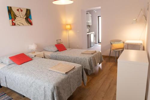 a small room with two beds and a kitchen at Nomad Sud Studios in Town Center in Cahul