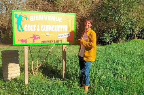 a man standing in front of a sign at Cocon aux portes des Cévennes avec piscine in Moulès-et-Baucels