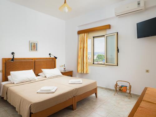 Posteľ alebo postele v izbe v ubytovaní Fotis Studios Apartments