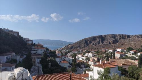 a view of a town with a mountain at Oros Eros in Hydra