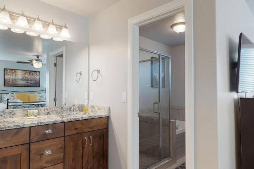 a bathroom with a double sink and a shower at Southern Comfort-Pool! Hot Tub! in Washington