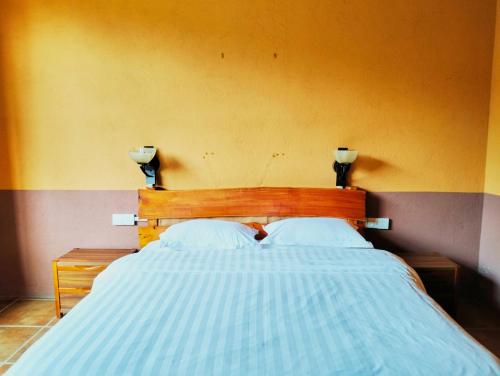 Cama o camas de una habitación en YangShuo Eden Inn