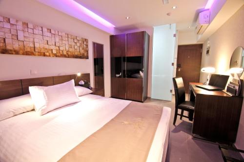 Postel nebo postele na pokoji v ubytování Achilleos City Hotel