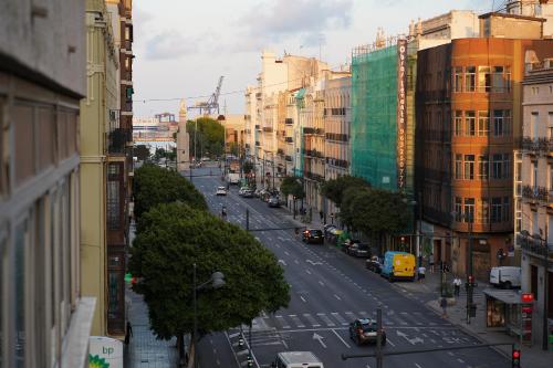 a view of a city street with cars and buildings at BET Apartments - Suites Puerto Valencia in Valencia
