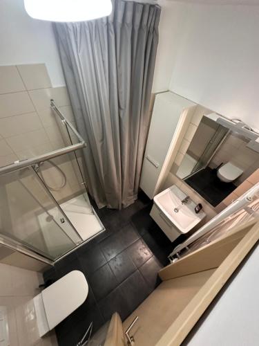 an overhead view of a bathroom with a sink and mirror at Apartmán ERUDITO in Jihlava