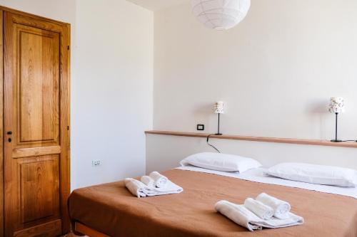 Ένα ή περισσότερα κρεβάτια σε δωμάτιο στο Agriturismo biologico Bulichella