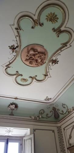 a ceiling with a painting on the ceiling at B&B DON FILIPPO in Pacentro