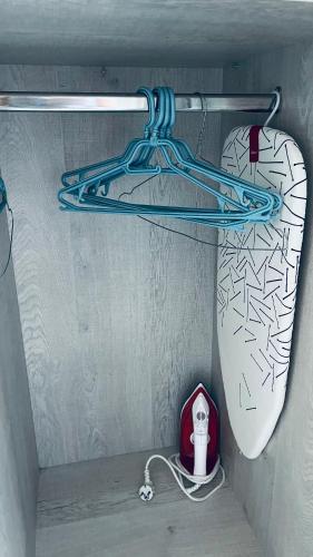 a surfboard and a hanger on a wall at Theros Room in Nydri