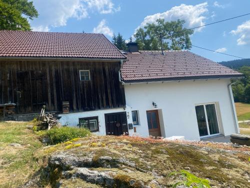 a house on top of a hill with at Ferienhaus Plöckenstein in Schwarzenberg am Bohmerwald