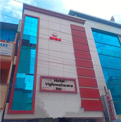 a hotel vijaynaya inn sign on the side of a building at HOTEL VIGHNESHWARA INN in Vijayawāda